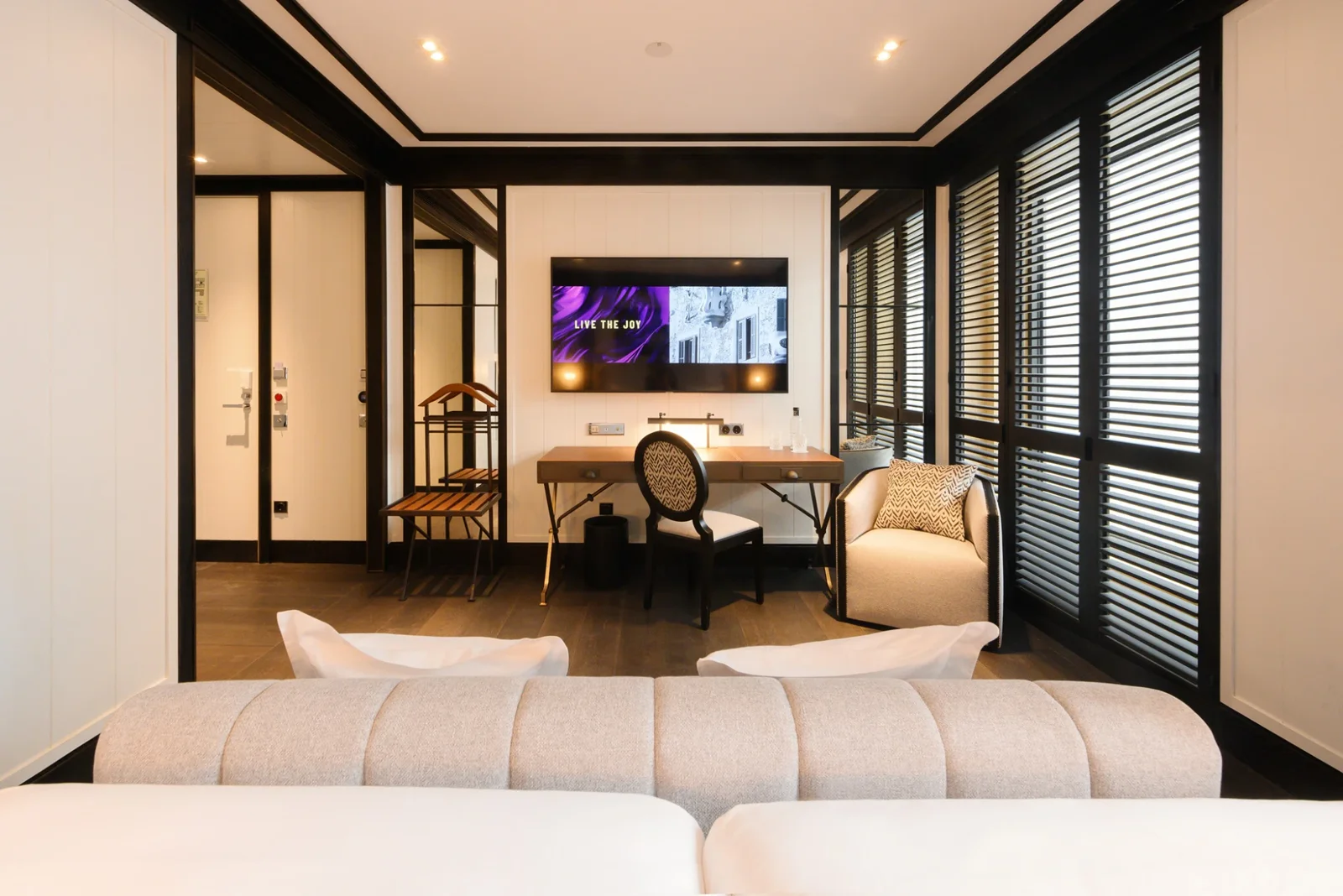 The Lounge Terrace room, shutters open onto the terrace
