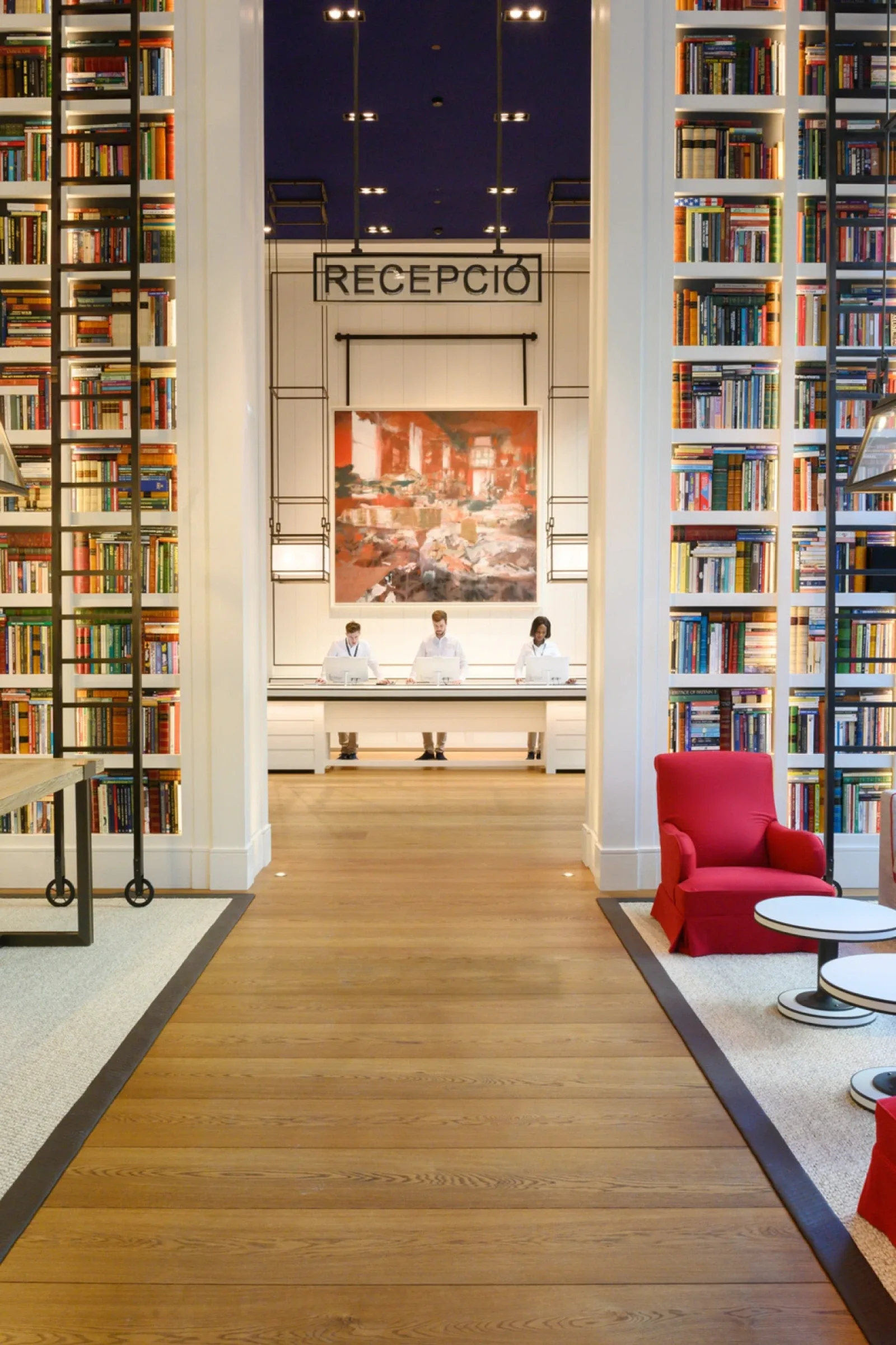 Seventy Live, the 1,500 m² lobby lined floor to ceiling with books